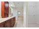 Bright bathroom with double vanity, walk-in closet, and tub at 8 Ocean Dr, Punta Gorda, FL 33950
