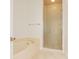 Bright bathroom featuring a standalone tub and a glass-enclosed shower at 8 Ocean Dr, Punta Gorda, FL 33950