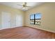 Bedroom featuring wood floors and a window with a view of the pool at 8 Ocean Dr, Punta Gorda, FL 33950