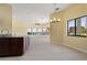 Dining room featuring tiled floors, waterfront views and an open floorplan at 8 Ocean Dr, Punta Gorda, FL 33950