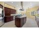 Modern kitchen featuring a center island, stainless steel appliances, and an open design at 8 Ocean Dr, Punta Gorda, FL 33950