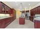 Spacious kitchen showcasing custom cabinetry, stainless steel appliances, and a central island at 8 Ocean Dr, Punta Gorda, FL 33950