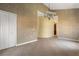 Open living room layout with tile flooring, neutral paint, and easy access to other rooms at 8 Ocean Dr, Punta Gorda, FL 33950