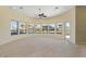 Sun-drenched living room with a wall of windows offering panoramic views of the canal at 8 Ocean Dr, Punta Gorda, FL 33950
