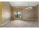 Inviting living room with large window showcasing a beautifully landscaped exterior at 8 Ocean Dr, Punta Gorda, FL 33950