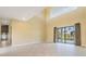 Living room with tall ceilings and access to the pool area and backyard at 8 Ocean Dr, Punta Gorda, FL 33950