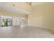 Bright, open living room with soaring ceilings, tile floors, and large windows offering plenty of natural light at 8 Ocean Dr, Punta Gorda, FL 33950