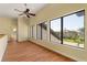 Upstairs living room with hardwood floors and three large windows with a view at 8 Ocean Dr, Punta Gorda, FL 33950