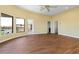 Bright and open living room with hardwood floors, ceiling fan, and views of the canal at 8 Ocean Dr, Punta Gorda, FL 33950