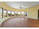 Bright and open living room with hardwood floors, ceiling fan, and views of the neighborhood at 8 Ocean Dr, Punta Gorda, FL 33950