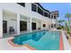 Beautiful in-ground pool with a patio area that overlooks the water and boat dock at 8 Ocean Dr, Punta Gorda, FL 33950