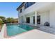 Backyard pool features a red brick border and white patio area at 8 Ocean Dr, Punta Gorda, FL 33950