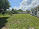 Expansive backyard features a privacy fence and plenty of space for outdoor activities and relaxation at 858 Conreid Ne Dr, Port Charlotte, FL 33952