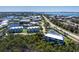 An aerial view highlighting a charming condo in a lush, scenic coastal area near local amenities at 10300 Tarpon Landings Ter # 4, Placida, FL 33946