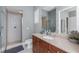 Elegant bathroom featuring a tiled shower, granite countertop, and stylish fixtures at 10300 Tarpon Landings Ter # 4, Placida, FL 33946