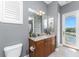 Elegant bathroom with a granite vanity, tiled shower and blue accent wall at 10300 Tarpon Landings Ter # 4, Placida, FL 33946