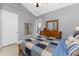 Bedroom with neutral walls, carpet, a ceiling fan, and ensuite bath with a wood dresser at 10300 Tarpon Landings Ter # 4, Placida, FL 33946