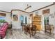 Open concept dining room area, with hardwood floors, a large window, and traditional furnishings at 10300 Tarpon Landings Ter # 4, Placida, FL 33946