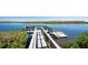Waterfront dock with seating, perfect for enjoying peaceful moments surrounded by nature and calm waters at 10300 Tarpon Landings Ter # 4, Placida, FL 33946