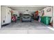 Spacious garage showcasing ample storage, a parked SUV, and various equipment at 10300 Tarpon Landings Ter # 4, Placida, FL 33946