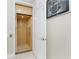 Hallway featuring a residential elevator, light walls, and tiled flooring at 10300 Tarpon Landings Ter # 4, Placida, FL 33946