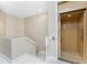 Hallway view with an elevator, stairs, and light walls leading to other areas at 10300 Tarpon Landings Ter # 4, Placida, FL 33946