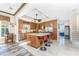 Kitchen with a center island, stainless steel appliances, and an adjacent dining area at 10300 Tarpon Landings Ter # 4, Placida, FL 33946