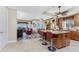 Kitchen with a center island, stainless steel appliances, and an adjacent living room at 10300 Tarpon Landings Ter # 4, Placida, FL 33946