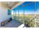 Spacious lanai with a wooden bench and screening offering beautiful views of the nearby trees at 10300 Tarpon Landings Ter # 4, Placida, FL 33946