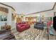 Spacious open concept living room with kitchen view, hardwood floors, recessed lighting, and traditional furnishings at 10300 Tarpon Landings Ter # 4, Placida, FL 33946