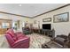 Comfortable living room features multiple couches, a decorative rug, a TV, and stylish decor at 10300 Tarpon Landings Ter # 4, Placida, FL 33946