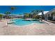 A large community pool featuring clear blue water, with stairs for easy entry and exit at 10300 Tarpon Landings Ter # 4, Placida, FL 33946