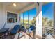Relaxing screened-in porch with outdoor seating and scenic views, perfect for entertaining at 10300 Tarpon Landings Ter # 4, Placida, FL 33946