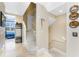 Staircase with neutral walls and decor with a small peek of a bedroom at 10300 Tarpon Landings Ter # 4, Placida, FL 33946