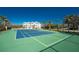 Enjoy tennis at your leisure with this well-kept community tennis court and beautiful complex in the background at 10300 Tarpon Landings Ter # 4, Placida, FL 33946