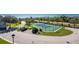 Aerial view of community tennis courts and parking at 10300 Tarpon Landings Ter # 4, Placida, FL 33946