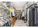 Organized walk-in closet with shelving and hanging space for clothes and accessories at 10300 Tarpon Landings Ter # 4, Placida, FL 33946