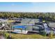 Aerial view of tennis and pickleball courts, showcasing a variety of recreational activities available at 12140 Wellen Golf St # 106, Venice, FL 34293