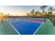 View of well-maintained pickleball courts, perfect for community recreation and active lifestyles at 12140 Wellen Golf St # 106, Venice, FL 34293