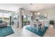 Elegant dining area with stylish furniture, artwork, and sliding glass doors that create an inviting atmosphere at 12141 Karney Ave, Port Charlotte, FL 33981