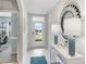Bright and airy entryway with tile floors, modern decor, a front door with view to the front yard at 12141 Karney Ave, Port Charlotte, FL 33981