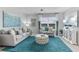 Cozy living room featuring modern furnishings, stylish décor, and large windows with scenic views at 12141 Karney Ave, Port Charlotte, FL 33981