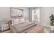 Beautiful bedroom with a plush bed, soft lighting, and a bench at 12149 Karney Ave, Port Charlotte, FL 33981