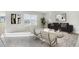 Inviting living room featuring neutral colors, modern decor, and ample natural light from the large window at 12149 Karney Ave, Port Charlotte, FL 33981