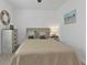 Comfortable bedroom featuring neutral decor, soft lighting, and ample space at 1353 Newton St, Port Charlotte, FL 33952