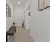 Bright hallway with tile flooring, neutral walls, and decorative accents at 1353 Newton St, Port Charlotte, FL 33952