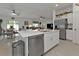 Spacious kitchen featuring a large island, stainless steel appliances, and an adjacent dining area at 1353 Newton St, Port Charlotte, FL 33952