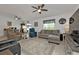 Bright open-concept living space features a sitting area, dining area and lots of natural light at 1353 Newton St, Port Charlotte, FL 33952