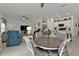 Open-concept living space features tile flooring, dining area, living room and modern kitchen at 1353 Newton St, Port Charlotte, FL 33952