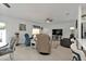Comfortable living space with tile floors, a television, two recliner chairs, and a dining area at 1353 Newton St, Port Charlotte, FL 33952